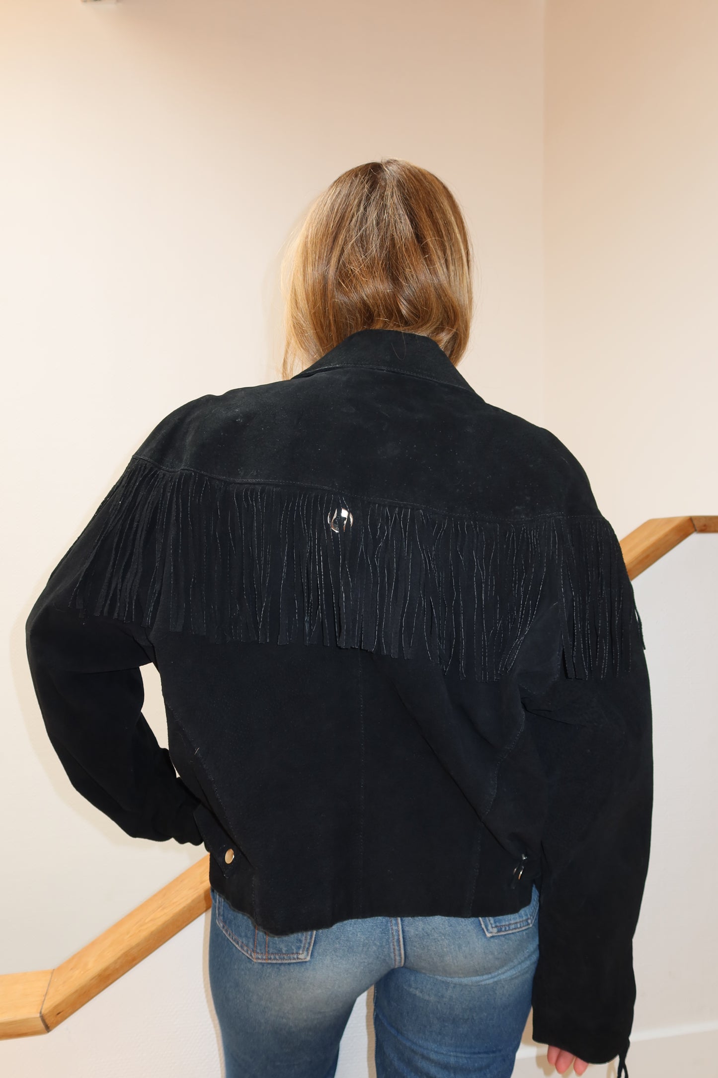 Veste en cuir noire à franges
