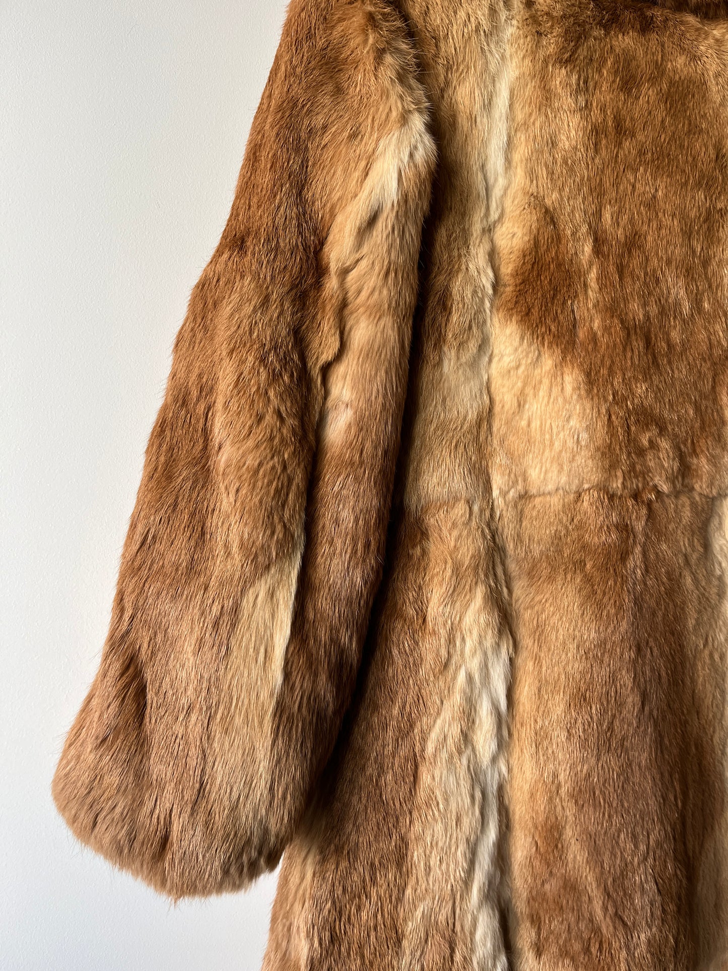 Manteau long en fourrure beige