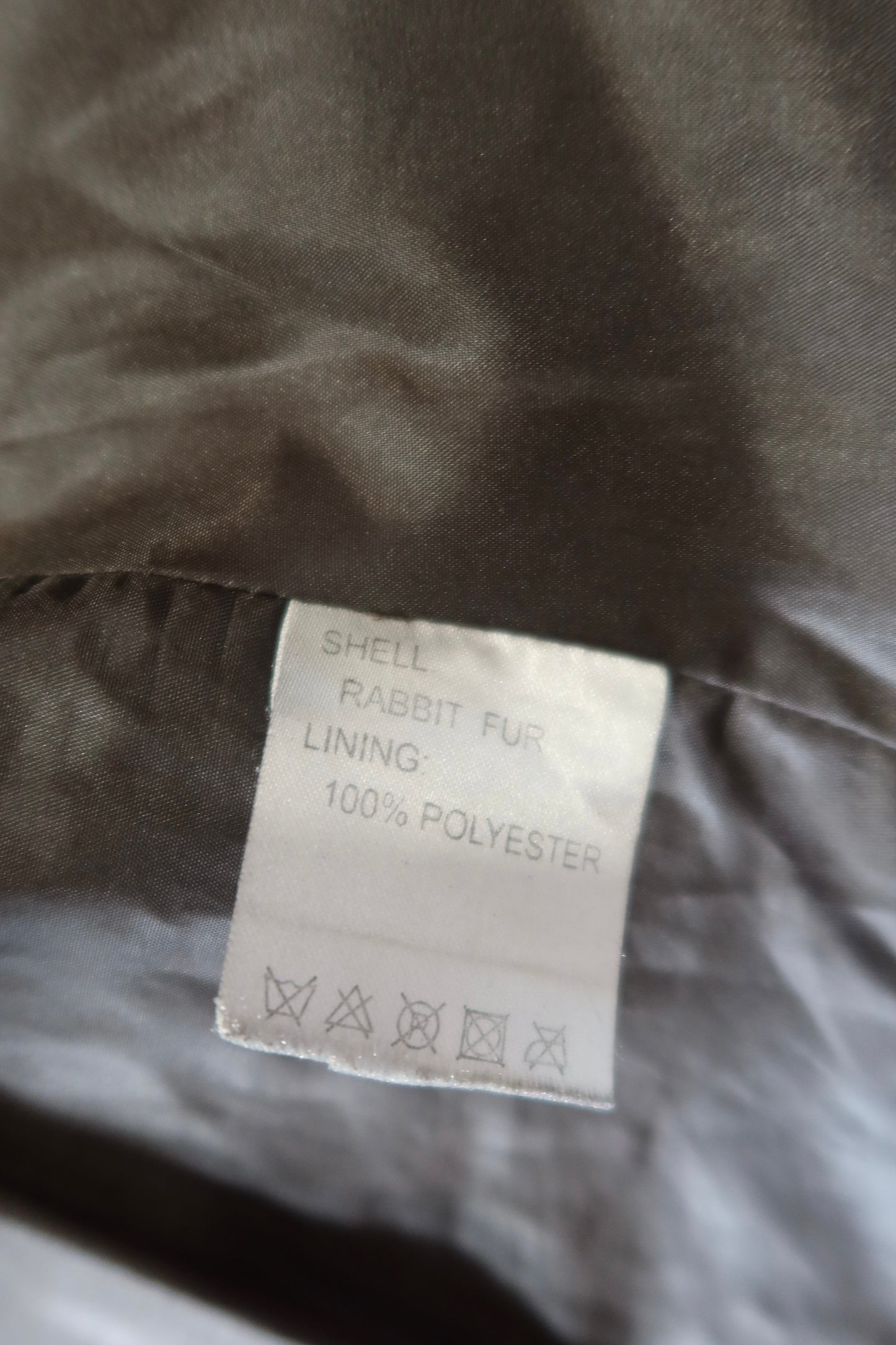 Veste en fourrure et daim grise avec ceinture