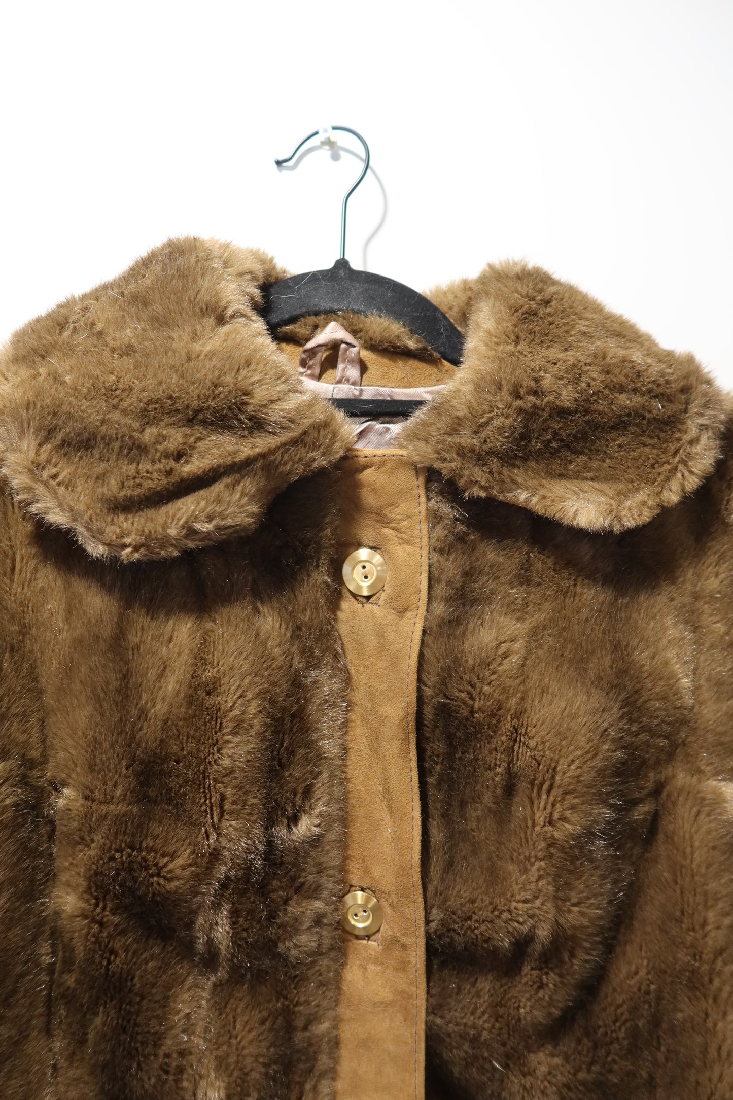 Veste marron en cuir et fausse fourrure
