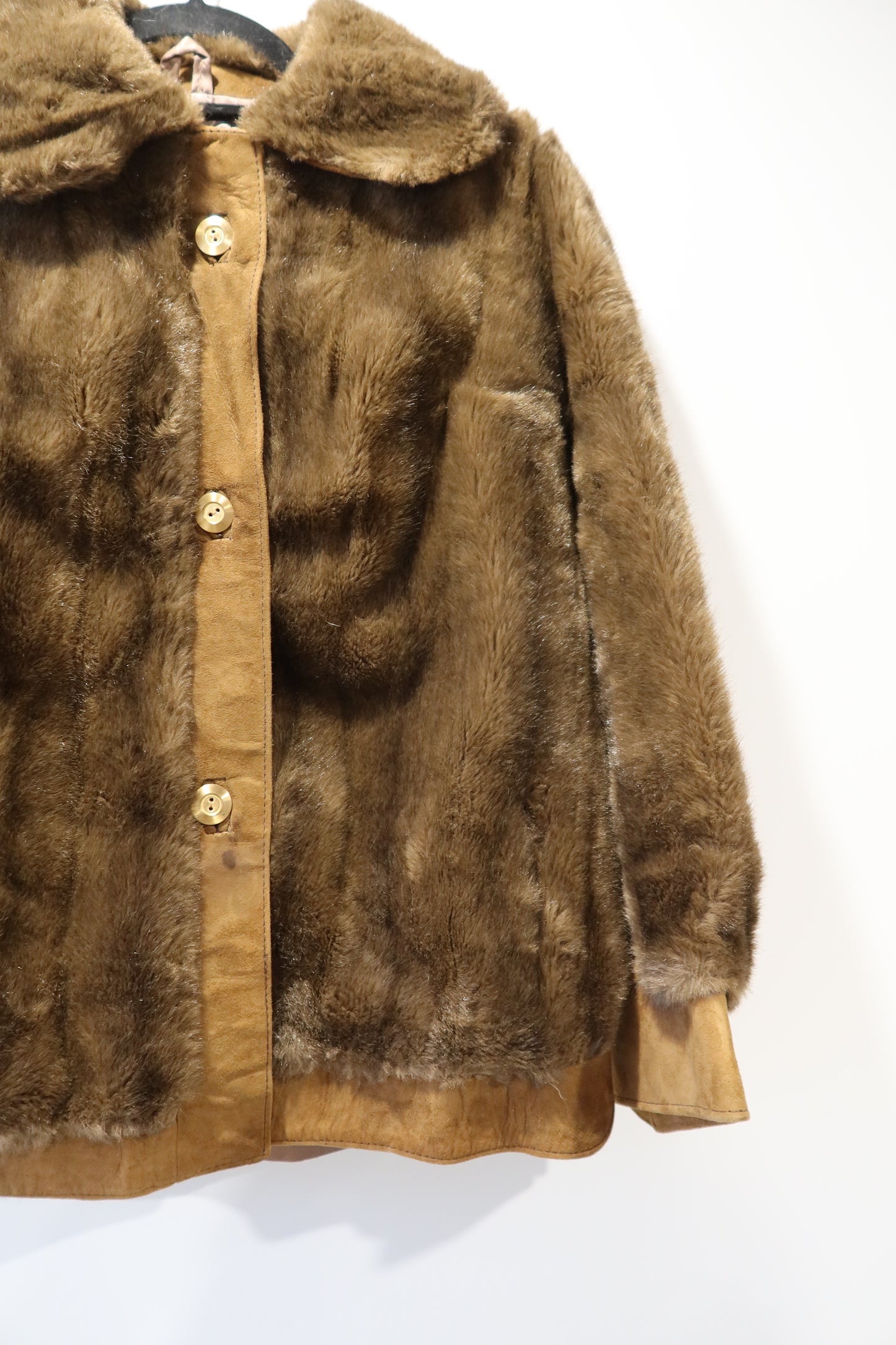 Veste marron en cuir et fausse fourrure