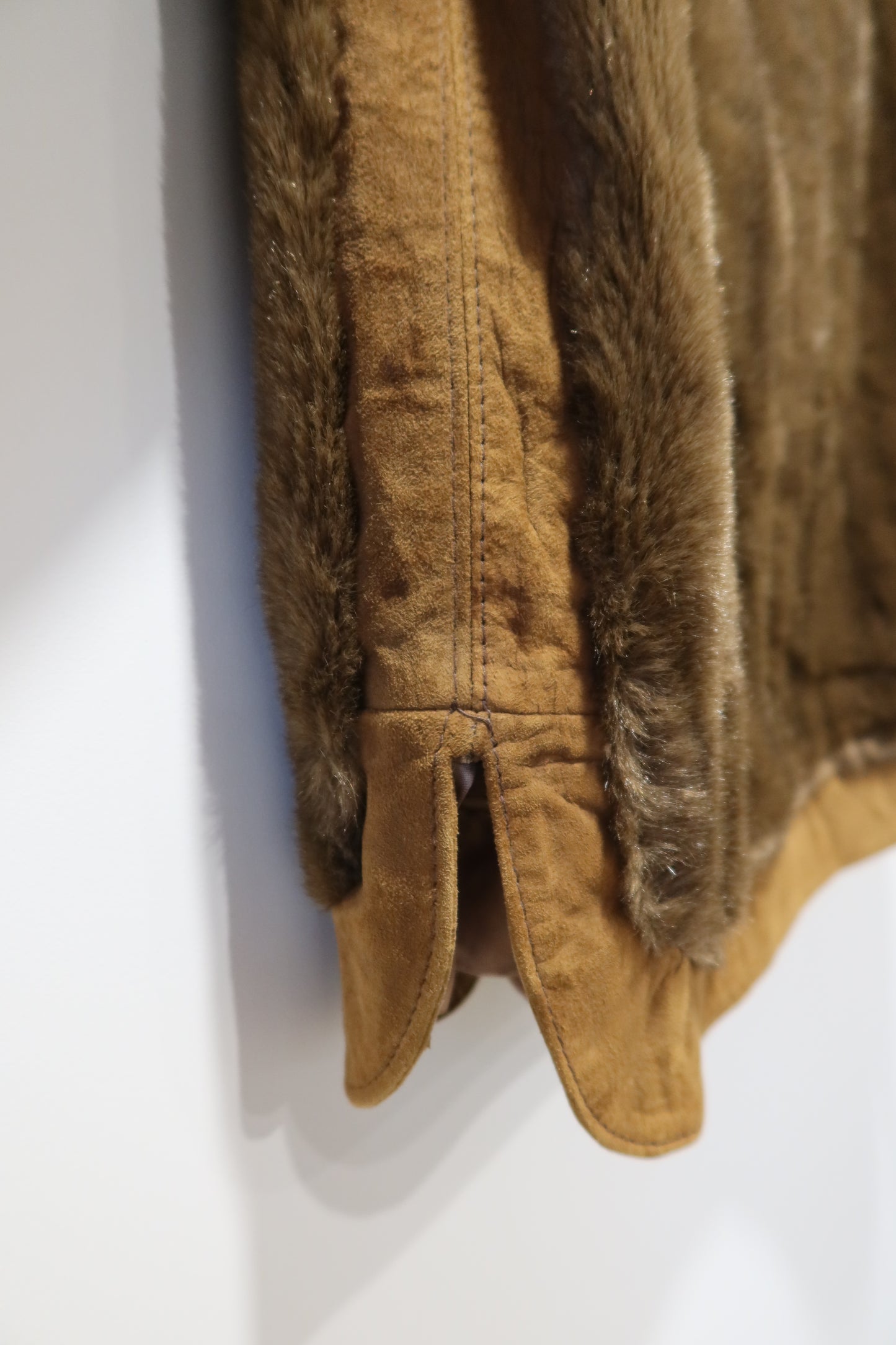 Veste marron en cuir et fausse fourrure