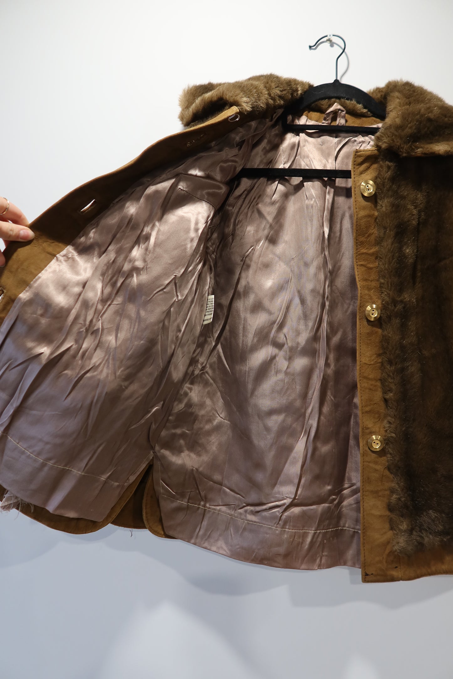 Veste marron en cuir et fausse fourrure