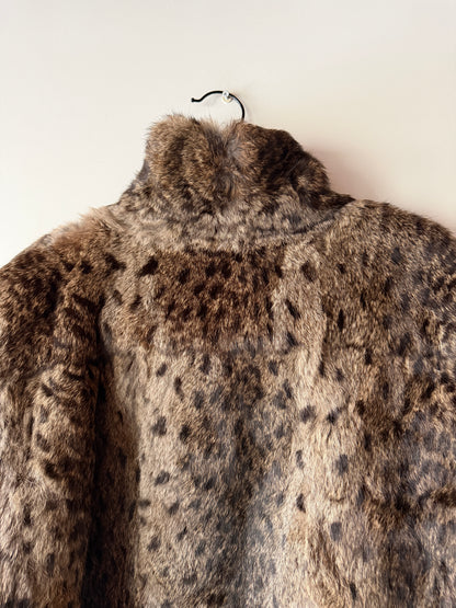 Veste en fourrure imprimée et cuir noir