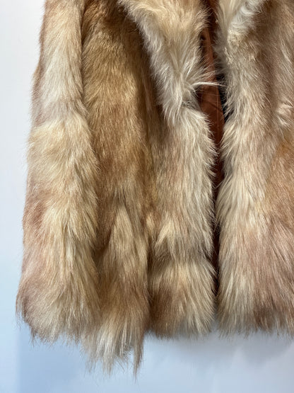Manteau en fourrure beige