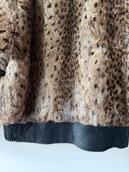 Veste en fourrure imprimée et cuir noir